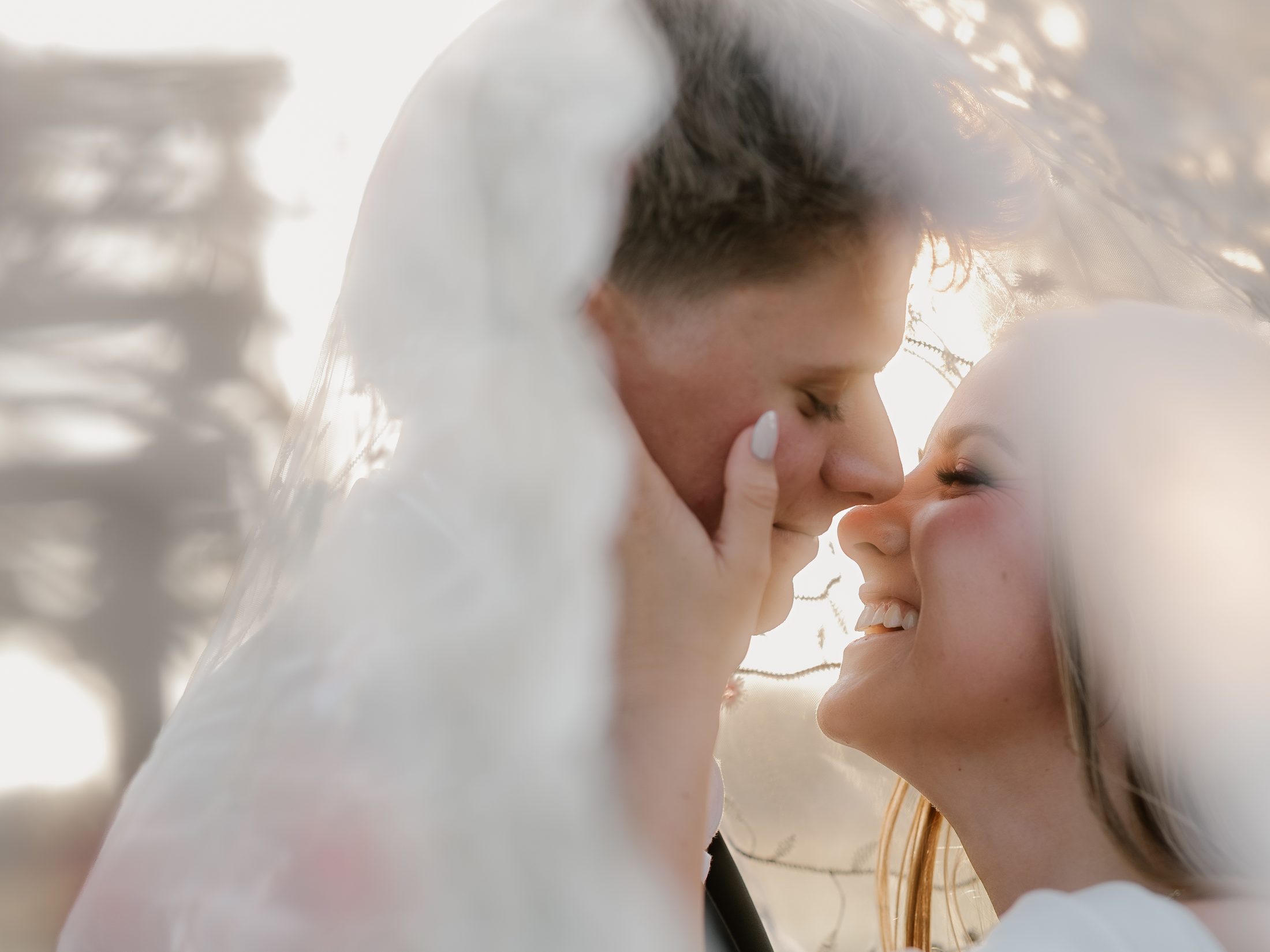 Wedding couple sharing an intimate moment in warm light