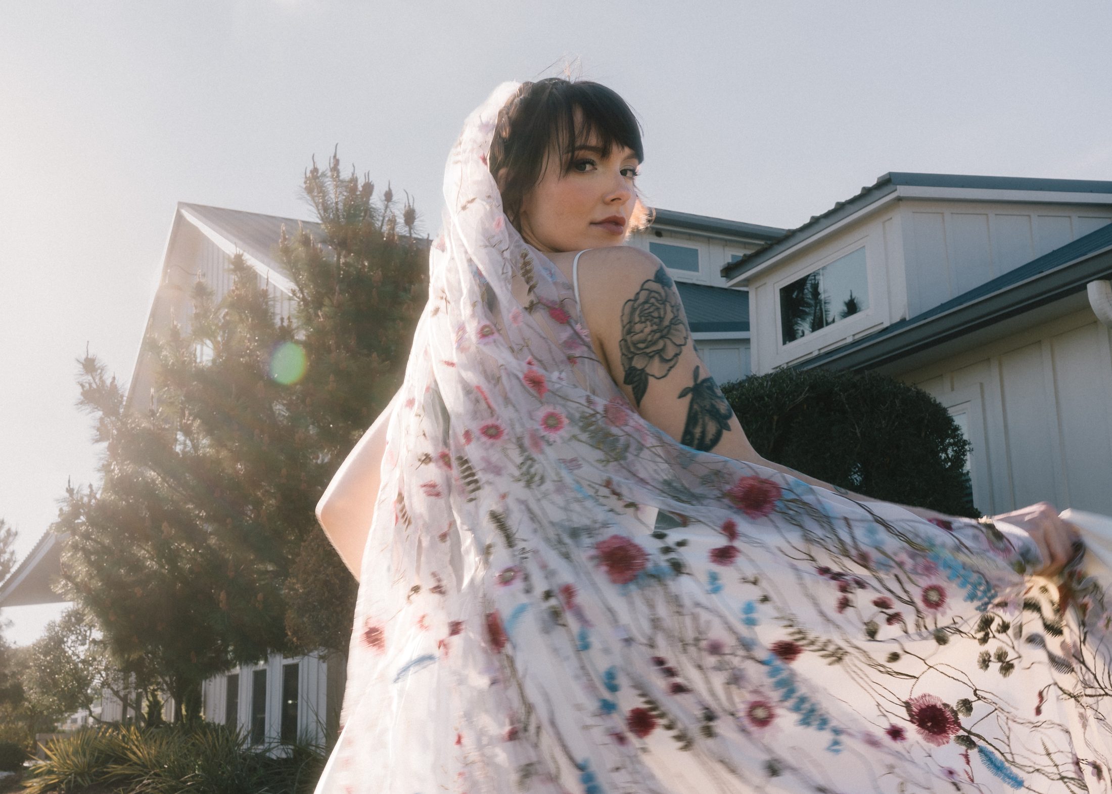 Bride in floral veil in the sun